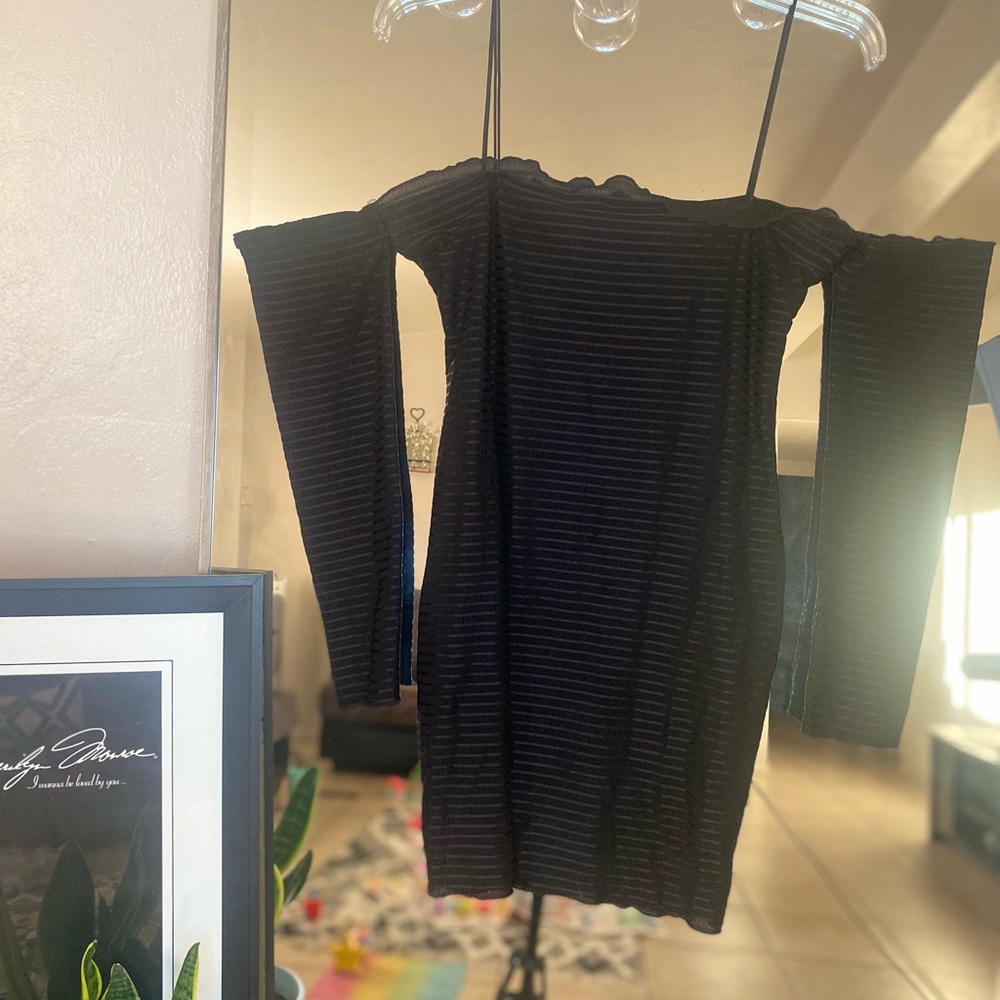 Black mini dress. Off the shoulder.
